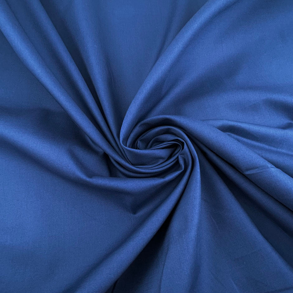 Lightweight China Blue cotton gabardine with a soft, non-stretch finish. Ideal for making shirts. High-quality deadstock collected in Stock from a Maison de Couture in Italy.