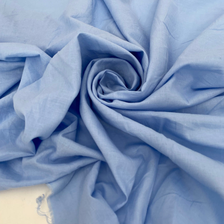 Pure cotton batiste in powder blue, very soft, light, flowy and not transparent. Ideal for shirting, dresses and skirts. High-quality deadstock collected in Stock from a Maison de Couture in Italy.