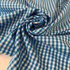 Pure cotton poplin in blue with a small check design (square size approx. half a centimeter). Very soft, light, and not transparent—ideal for shirts, dresses, and skirts. High-quality deadstock collected in Stock from a Maison de Couture in Italy.