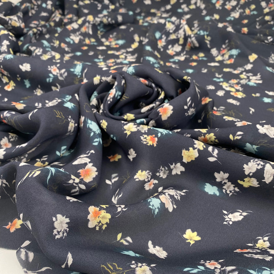 Pure silk with a subtle sheen and small floral design, dark blue base, slightly transparent. Ideal for blouses, dresses, and delicate layers. High-quality deadstock collected in Stock from a Maison de Couture in Italy.