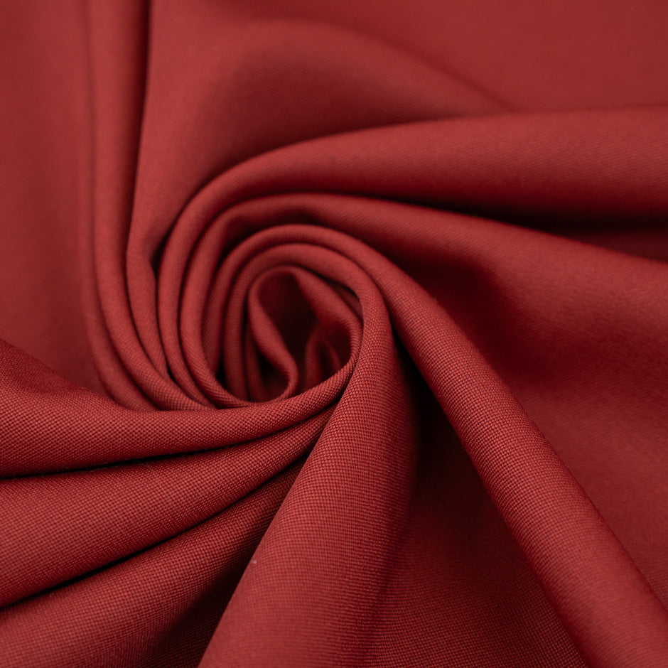 Soft and falling pure red wool gabardine. High-quality deadstock fabric collected in Stock from a Maison de Couture in Italy.