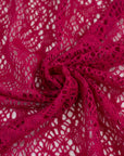 Fucsia lace wool and polyester with a geometric pattern. The fabric is stretch and falling. High-quality deadstock fabric collected in Stock from a Maison de Couture in Italy.