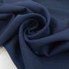 Double acetate and viscose cady in navy blue with a shiny side, it's heavy and stiff. High-quality deadstock fabric collected in Stock from a Maison de Couture in Italy.