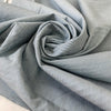 Stretch cotton fabric with a fine striped pattern in light blue. Very soft and light, ideal for shirts, dresses, and skirts. High-quality deadstock collected in Stock from a Maison de Couture in Italy.