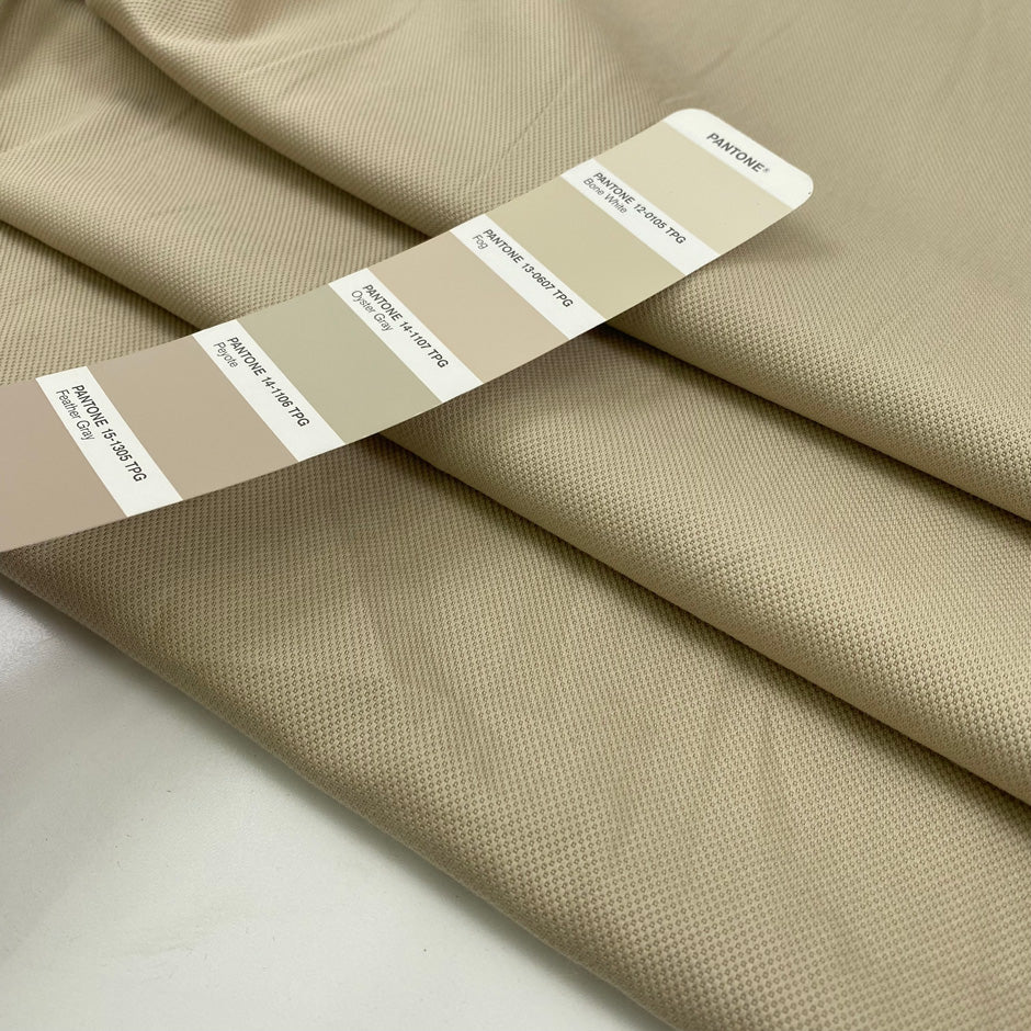 Stretch cotton with textured structure in camel color. High-quality deadstock fabric collected in Stock from a Maison de Couture in Italy.