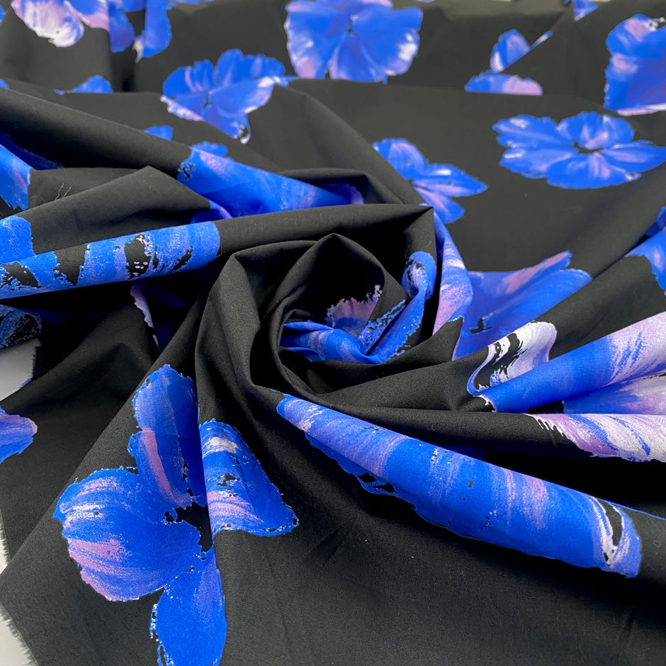 Pure cotton poplin with elastane, black base with floral print in shades of blue and pink. Very soft and not transparent. High-quality deadstock collected in Stock from a Maison de Couture in Italy. 