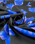 Pure cotton poplin with elastane, black base with floral print in shades of blue and pink. Very soft and not transparent. High-quality deadstock collected in Stock from a Maison de Couture in Italy. 