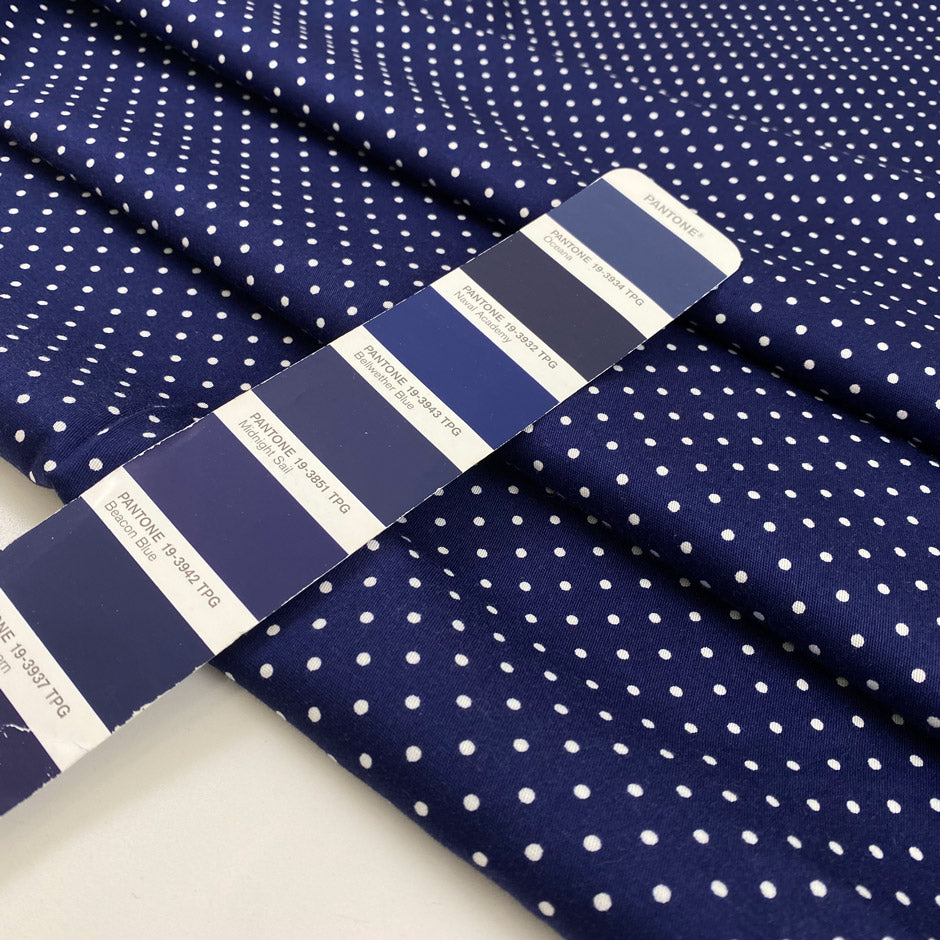 Pure cotton stretch fabric with a blue base and white polka dot design, very soft, medium weight, and not transparent. Ideal for shirts, dresses, and skirts. High-quality deadstock collected in Stock from a Maison de Couture in Italy.