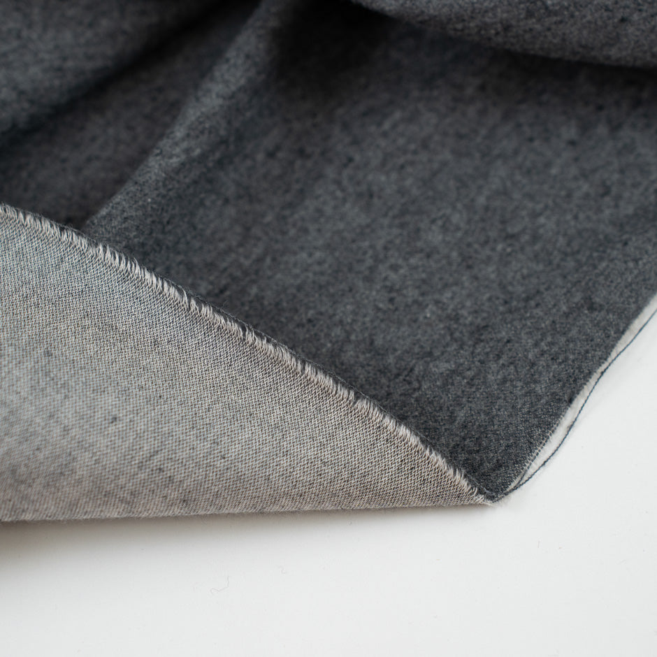 Dark gray colored heavy and falling cotton flannel. &amp;nbsp;High-quality deadstock fabric collected in Stock from a Maison de Couture in Italy.