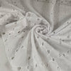 White cotton Sangallo lace with delicate embroidered eyelets and soft, breathable texture ideal for blouses dresses and summerwear. High-quality deadstock collected in Stock from a Maison de Couture in Italy.