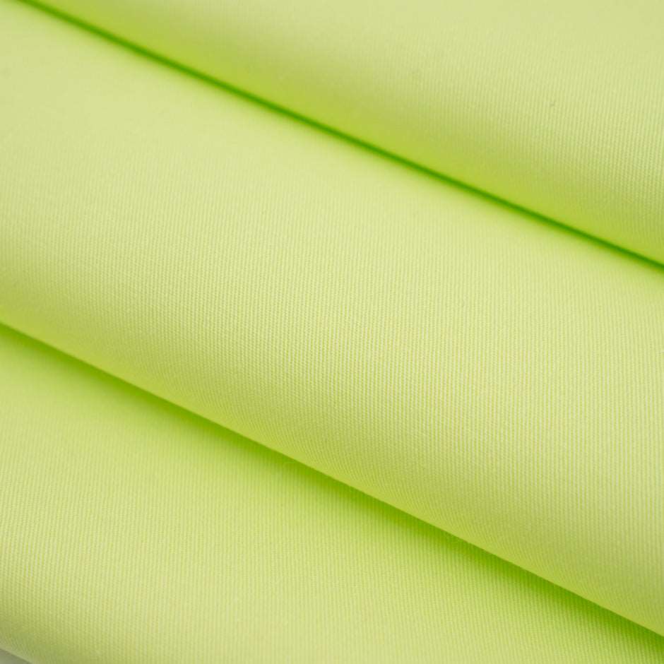Textured fabric of pure bright green cotton. High-quality deadstock fabric collected in Stock from a Maison de Couture in Italy.
