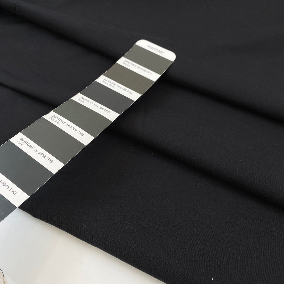 Very soft and warm-touch stretch cotton in black. Lightweight and solid color. High-quality deadstock collected in Stock from a Maison de Couture in Italy.