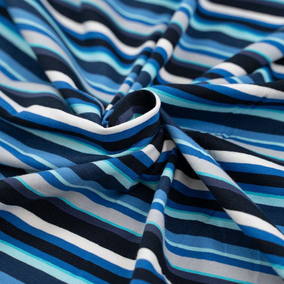 Cotton jersey with blue and white stripes blue background, soft and stretchy. Deadstock fabric picked up from a Maison de Couture in Italy.