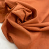 Cotton and linen blend in orange color reference Sunbaked, very soft and not transparent. Ideal for trousers, skirts, dresses, and light summer jackets. High-quality deadstock collected in Stock from a Maison de Couture in Italy.
