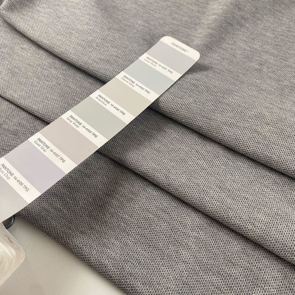 Stretch fabric with textured surface in light gray color reference Quiet Gray. Very soft and light, ideal for t-shirts and dresses. High-quality deadstock collected in Stock from a Maison de Couture in Italy.