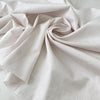 Pure cotton shirting fabric with a white ground and pale pink stripe. Very soft, light, and not transparent. Ideal for shirting and dresses. High-quality deadstock collected in Stock from a Maison de Couture in Italy.