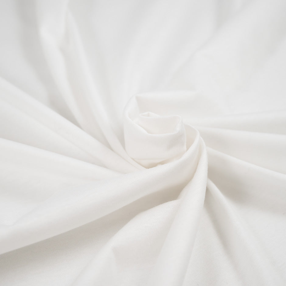 Pure white textured cotton jersey. High-quality deadstock fabric collected in Stock from a Maison de Couture in Italy.