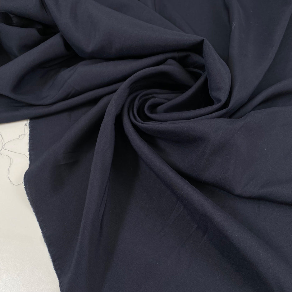 Dark blue silk crepe de chine, soft, stretchy and light. High-quality deadstock fabric collected in Stock from a Maison de Couture in Italy.