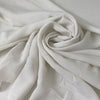 Very soft and light silk and acetate fabric with a crushed effect in white. Slightly transparent and flowy, perfect for blouses, shirting, dresses, and skirts. High-quality deadstock collected in Stock from a Maison de Couture in Italy.
