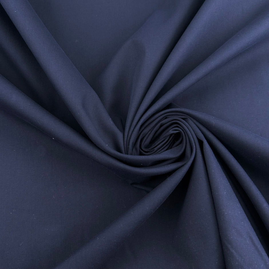 Dark blue cotton gabardine with a soft, non-stretch finish. High-quality deadstock collected in Stock from a Maison de Couture in Italy.