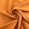 Dark yellow viscose cady crepe fabric with a soft hand, non-stretch constructionand not transparent. Ideal for creating trousers. High-quality deadstock collected in Stock from a Maison de Couture in Italy.