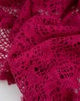 Fucsia lace wool and polyester with a geometric pattern. The fabric is stretch and falling. High-quality deadstock fabric collected in Stock from a Maison de Couture in Italy.