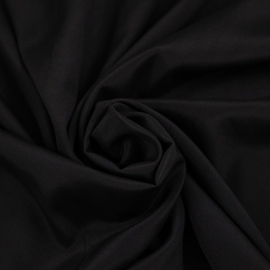 Silk crepe de chine and acetate black and falling fabric. High quality deadstock.
