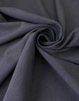 Soft and flowy stretch wool in dark gray. Comfortable and versatile, ideal for trousers, dresses, skirts, and jackets.High-quality deadstock collected in Stock from a Maison de Couture in Italy.