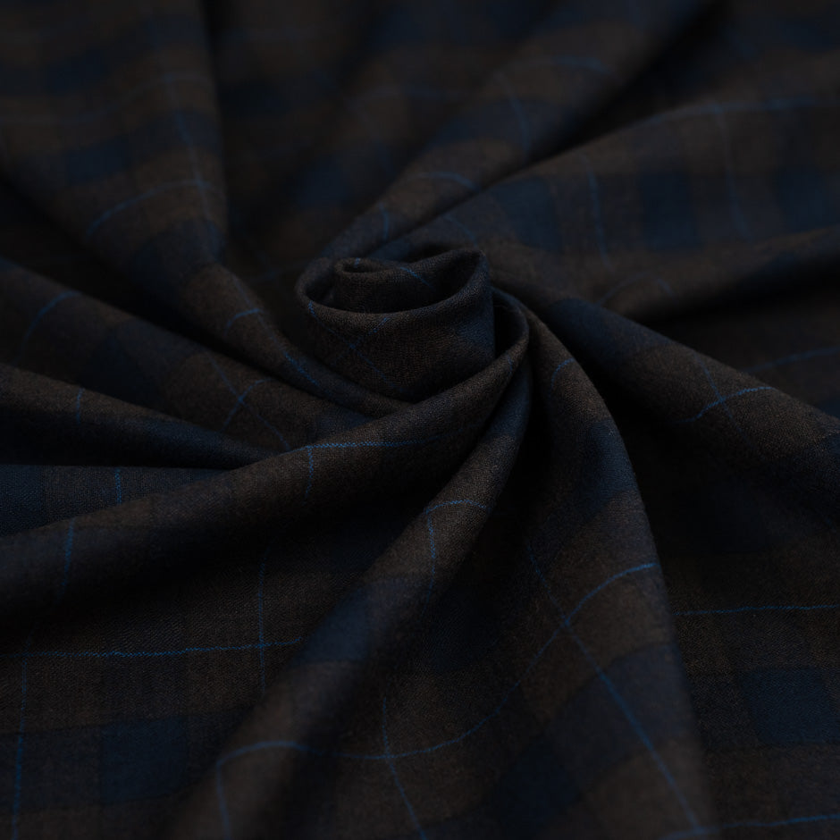 Lightweight blue and brown checked flannel pure virgin wool. High-quality deadstock fabric collected in Stock from a Maison de Couture in Italy.