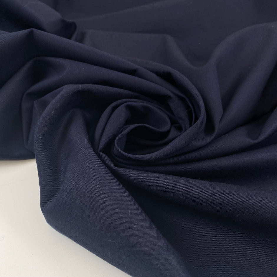 Very soft, medium-weight elasticized cotton in a rich midnight blue. Not transparent and ideal for structured yet comfortable garments. High-quality deadstock collected in Stock from a Maison de Couture in Italy.