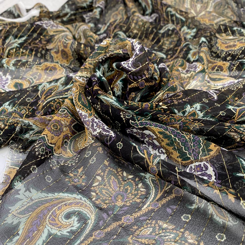 Silk and lurex chiffon with black ground and cashmere design. Very soft, light, transparent and flowy. High-quality deadstock fabric collected in Stock from a Maison de Couture in Italy.