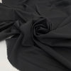 Very soft and flowing polyester georgette in a dark gray shade, color reference Meteorite. Ideal for dresses, skirts, blouses, and shirting. High-quality deadstock collected in Stock from a Maison de Couture in Italy.