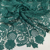 Light and soft polyester macro lace in dark green with a double scallop edge and baroque floral design. Perfect for dresses, skirts, and blouses.High-quality deadstock collected in Stock from a Maison de Couture in Italy.
