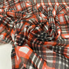 Stretch tulle with check design in white, red and black shades. A little stiff, very light and transparent. High-quality deadstock fabric by the meter collected in Stock from a Maison de Couture in Italy.