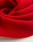 Pure virgin wool double crepe fabric, red and textured. High quality deadstock fabric.