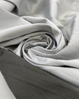 Silk and polyester Mikado double face, dark and light gray very soft. High-quality deadstock fabric collected in Stock from a Maison de Couture in Italy.