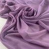 Stretch microtulle in regal orchid. Very light, transparent, flowy and soft – ideal for dresses, underwear, and t-shirts. High-quality deadstock collected in Stock from a Maison de Couture in Italy.