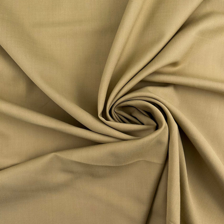 Beige stretch wool and very soft. Perfect for trousers. High-quality deadstock collected in Stock from a Maison de Couture in Italy.