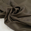 Polyester jacquard in dark brown with an ultra-small pattern, very soft, light, and slightly shiny, ideal for dresses, shirts, and fluid tailoring. High-quality deadstock collected in Stock from a Maison de Couture in Italy.