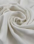 Pure viscose crepe cady in white, very soft, light, and flowy. Just a bit transparent. High-quality deadstock fabric collected in Stock from a Maison de Couture in Italy.