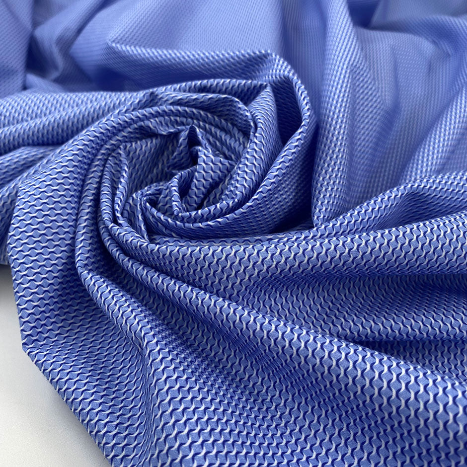 Pure cotton poplin in shades of light blue, very soft and light with a very tiny design. High-quality deadstock fabric collected in Stock from a Maison de Couture in Italy.