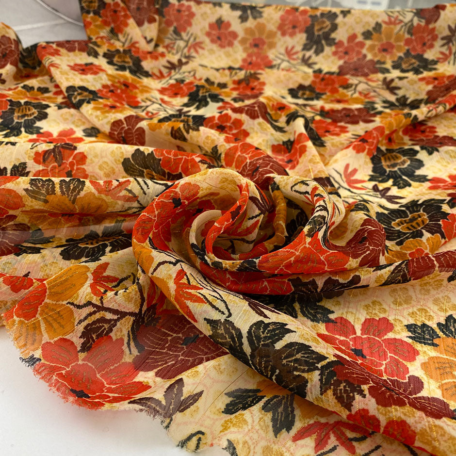 Polyester and lurex chiffon in orange and red shades. Very soft, flowy and, transparent. High-quality deadstock fabric by the meter collected in Stock from a Maison de Couture in Italy.