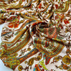 Printed soft polyester twill with small drawings. Orange, beige and bright green floral design. High-quality deadstock fabric collected in Stock from a Maison de Couture in Italy.