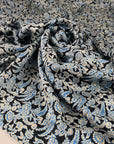 Pure soft viscose with dark blue base, white and light blue floral pattern. High-quality deadstock fabric collected in Stock from a Maison de Couture in Italy.