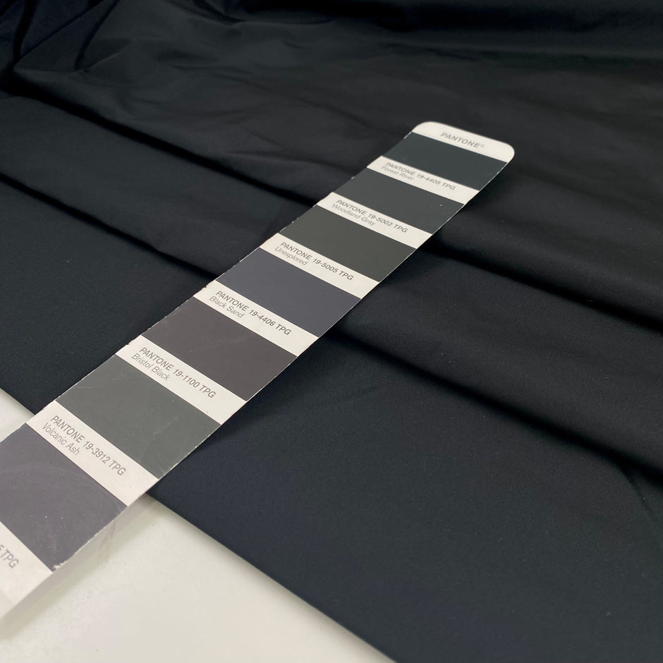 Very light black polyester taffeta with a crisp crunchy texture ideal for structured garments and voluminous shapes. High-quality deadstock collected in Stock from a Maison de Couture in Italy.