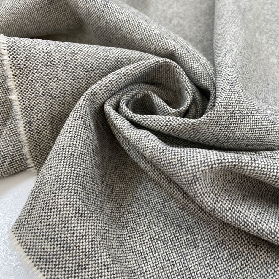 Pure wool in light gray with white threads, very soft and warm with a heavy hand. Ideal for coats, jackets, and structured pieces. High-quality deadstock collected in Stock from a Maison de Couture in Italy.