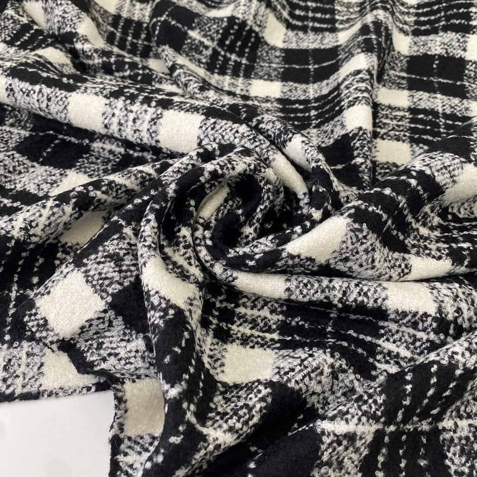 Very soft and warm wool blend with check design in the shades of black and white, color reference Coconut Milk and Forest River. Ideal for coats and jackets. High-quality deadstock collected in Stock from a Maison de Couture in Italy.Very soft and warm wool blend with check design in the shades of black and white, color reference Coconut Milk and Forest River. Ideal for coats and jackets. High-quality deadstock collected in Stock from a Maison de Couture in Italy.Very soft and warm wool blend with check des