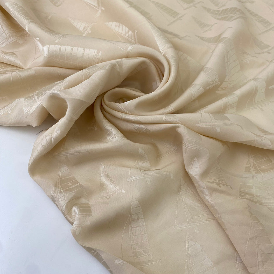 Silk jacquard in vanilla color, reference Alabaster Gleam. Very soft and light, flowy, ideal for dresses, skirts, blouses, and shirting. High-quality deadstock collected in Stock from a Maison de Couture in Italy.