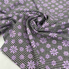 Mixed polyester and wool with pied de poule in black and white and flower design in lilac. Very soft and light, warm. Ideal for dresses, trousers, skirts and jackets.High-quality deadstock collected in Stock from a Maison de Couture in Italy.