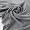 Pure silk crepe de chine in goth gray. Very soft and light, flowy, and not transparent. Ideal for shirting, blouses, dresses, and skirts. High-quality deadstock collected in Stock from a Maison de Couture in Italy.